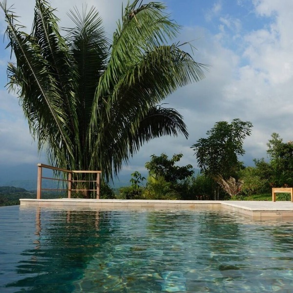 Stunning infinity pool with ocean and mountain views for you to enjoy!