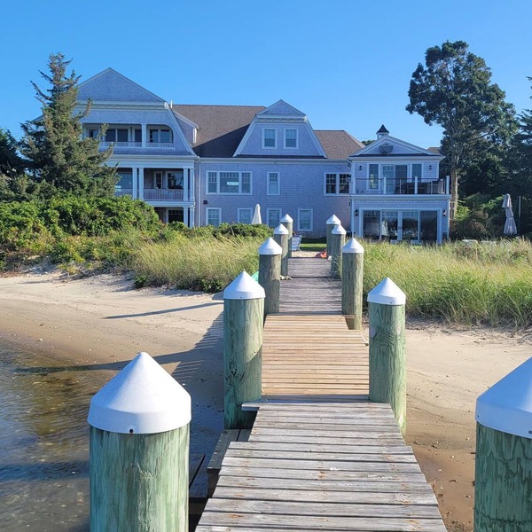 Stunning waterfront with sandy beach & dock walking distance to top restaurants!