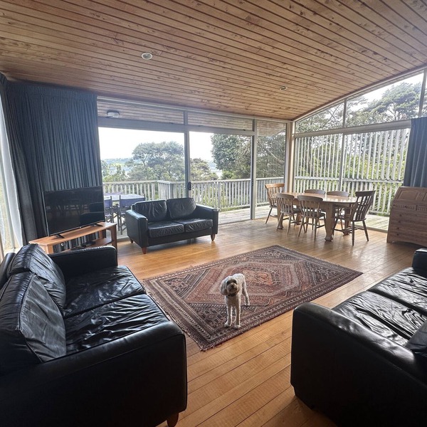 Sunny with decks and bush/harbour views. Three bedrooms. Pet friendly.