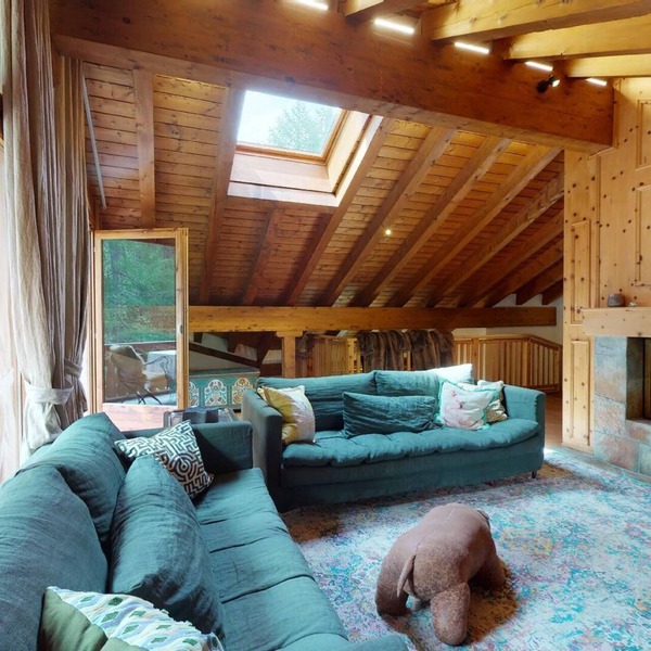 This exclusive duplex apartment right at the slope next to the forest offers app
