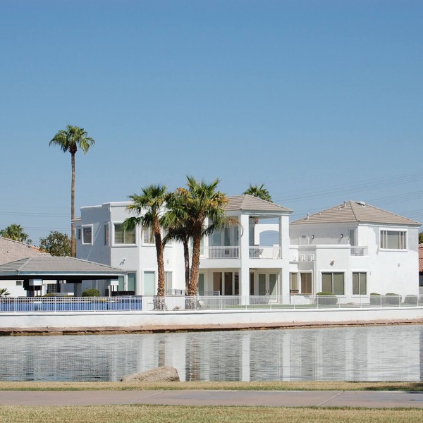 This GORGEOUS custom home is located on 3/4 acre waterfront in Gilbert Arizona