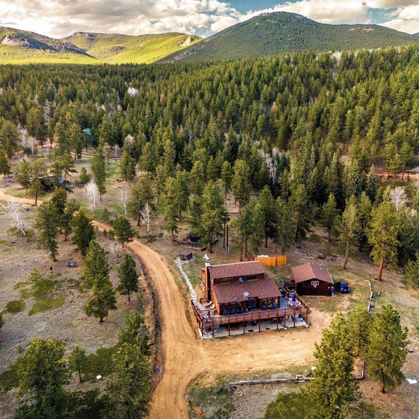 This is Colorado! Stunning views, killer hot tub, 12 acres, game barn+huge deck!