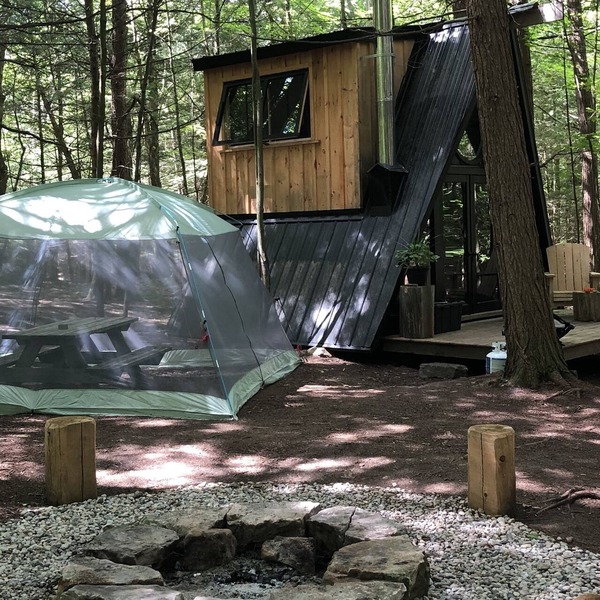 Tiny off-grid A-frame cabin nestled in nature!