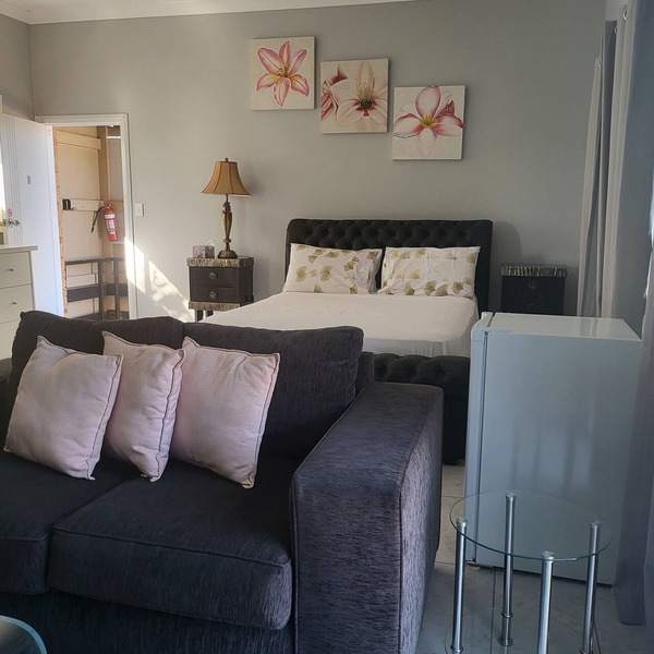 Top View Deluxe Self-Contained Room No 3 with Balcony Overlooking Swimming Pool.
