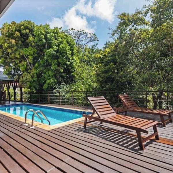 Tropical beachfront getaway with private pool, ocean views & enclosed yard