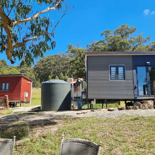 Unique two tiny homes set up with private dam