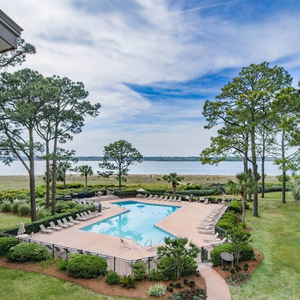 Updated & Gorgeous End Unit with Spectacular Views of Pool & Sound. South Beach Oasis Awaits you!