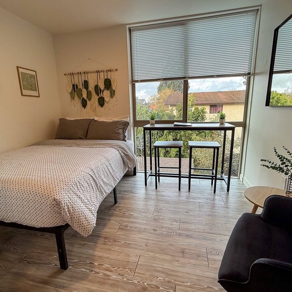 Urban studio unit with patio views, shared lounge space and dedicated workspace