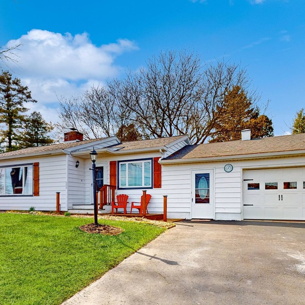 Waterfront home with stunning Owasco Lake view, dock, firepit & covered porch