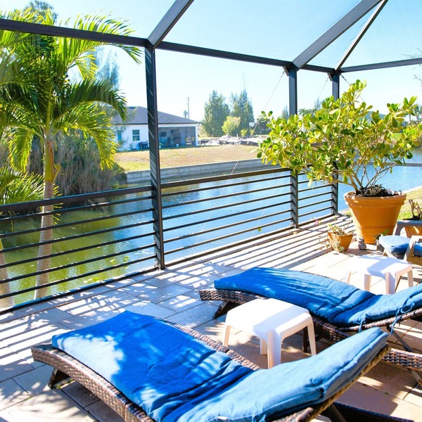 Waterfront home with oversized heated pool & spa, bikes, beach gear!