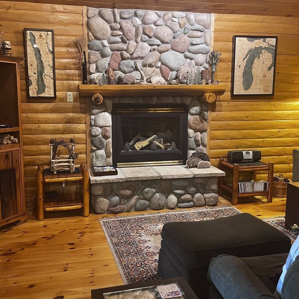 Waterfront log home on Lake Bellaire. Pet friendly. Fireplace, dock. Dog ok