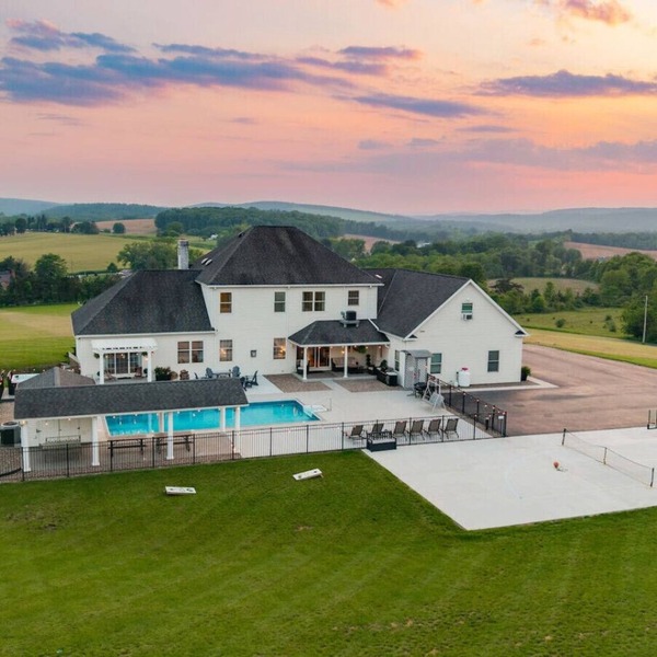 Willow Brook Mansion, an upscale retreat in the countryside with heated seasonal (May 1st - Oct. 1st) pool, hot tub and game room.