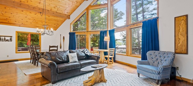 8.5-acre lakefront retreat with private beach, deck, grill, firepit, & game room