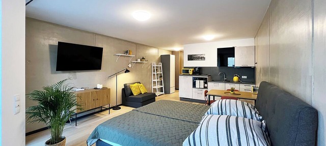 Bonquartier | Design apartment with balcony, parking space + charging station