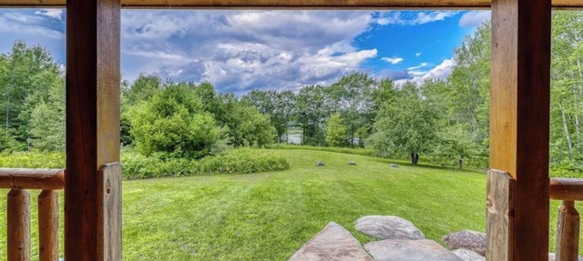 Bright three-level home with water views, jetted tub, firepit, and pool table