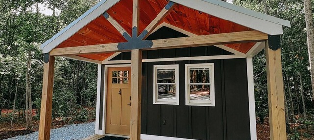 Cabin #4: Two queen-size beds with a kitchenette and a large gravel parking pad beside the cabin for easy boat or trailer storage.