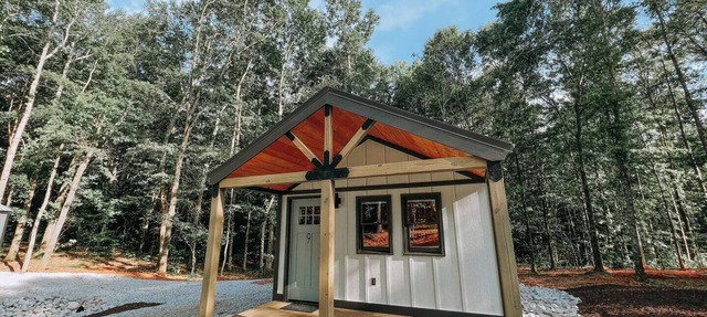 Cabin #9: One king-size bed, a kitchenette, and a large gravel parking pad beside the cabin for easy boat or trailer storage.