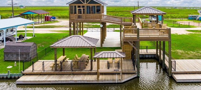 Canal front cutie with Boat lift, RV Hook-Up, Bay access, and Ocean view!