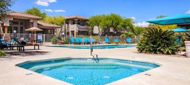 Cozy ground level resort style condo with heated pool/hot tub, and gym!