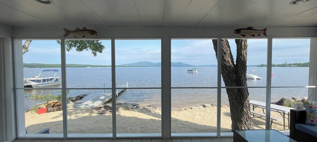 Cozy lakefront home on Ossipee Lake, w/beach, dock and amazing view.