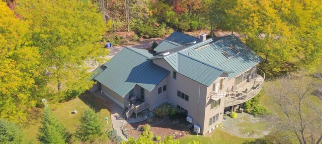 Custom 3-bedroom contemporary home on 10 rural acres yet near all amenities