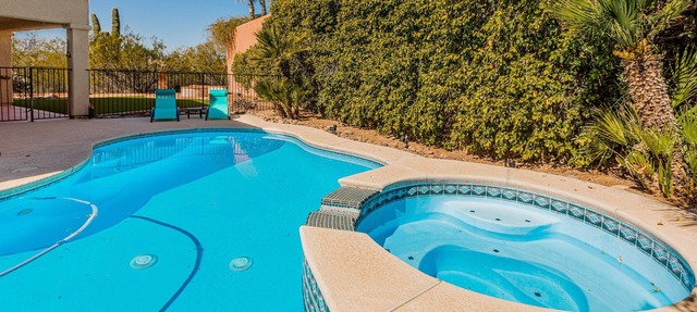 Dog-friendly golf course home with pool, spa, pool table, WiFi & Peloton