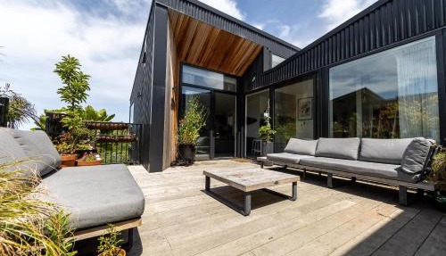 Elevated architectural home with stunning sea views