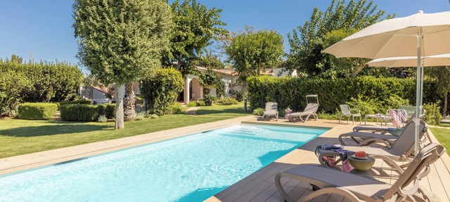 Exclusive villa with swimming pool surrounded by greenery