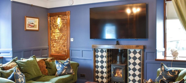 Experience cosy comfort in this Cairnbulg holiday home, featuring a log fire.