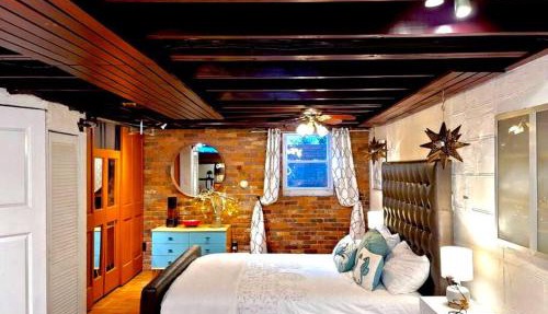 Live in this iconic East Side lower level unit