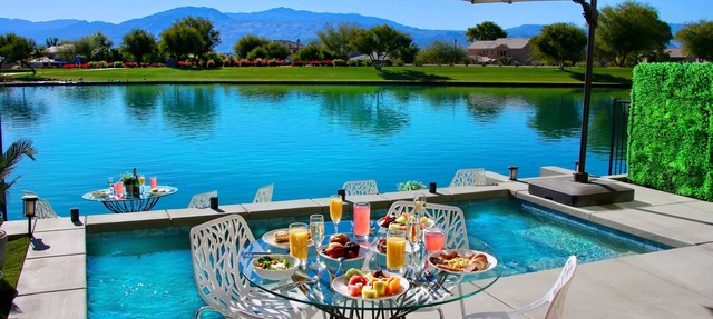 "Luxury Lakefront Paradise: Heated Pool Haven with Unrivaled Views"