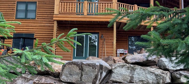 Luxury Log home steps from private beach in Meredith on Lake Winnipesaukee.