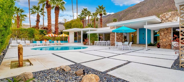 Mid-century modern estate with a pool, hot tub, gourmet kitchen, and fireplace