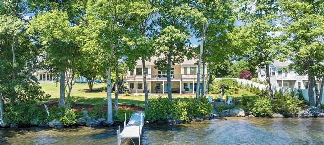 Modern Lake Opechee Home features Sandy Perched Beach and Dock