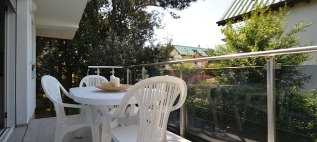 Modern villa surrounded by a fenced garden