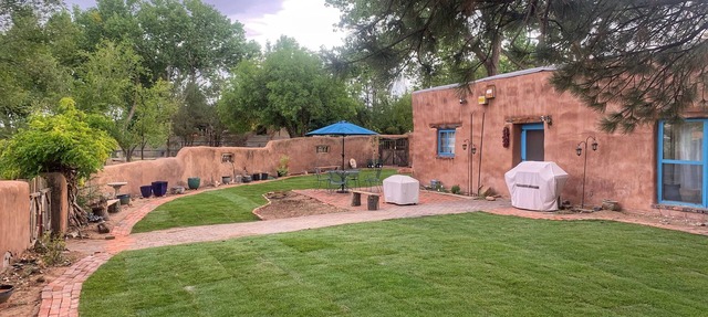 Peaceful artisan adobe with view of the Sandias