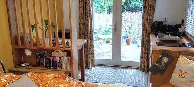 Peaceful separate annexe with bed, kitchen, shower room and patio area.