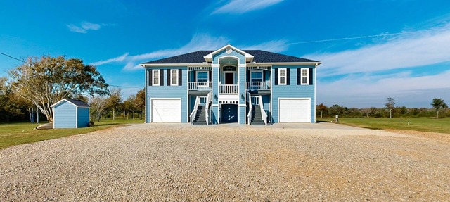 Private acreage next to the bayou with kayaks, porches, open layout, W/D, & AC