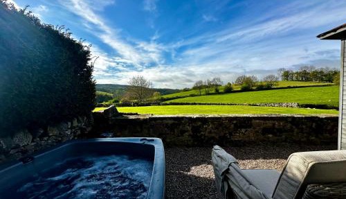 Romantic four poster Cottage private outdoor Hot Tub & Sauna at Harthill Hall plus private daily use of indoor pool and sauna 1 hour per day