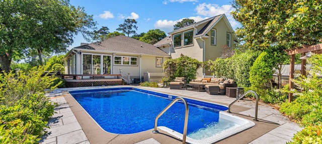 Shining Waters: Gorgeous waterfront home with private hot tub, pool, views, deck, & fireplace
