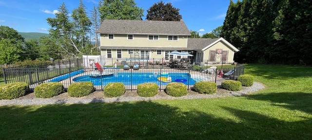 Spacious 4 bedroom, big pool & outdoor space. Close for local summer activities!