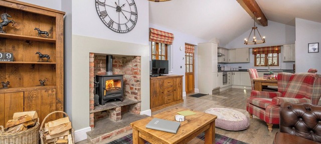 Spacious riverside lodge with mountain views.
