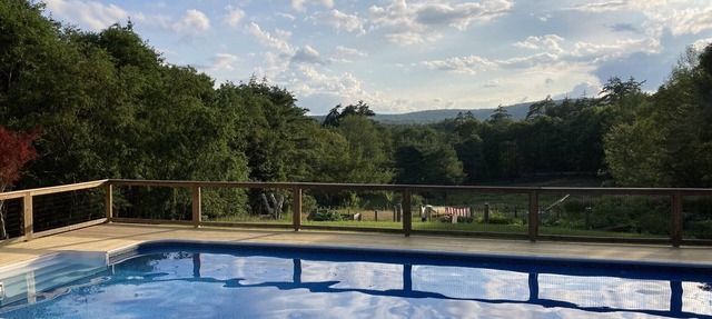 Spacious, unique home w/mountain views. Enjoy pool in summer, skiing in winter!