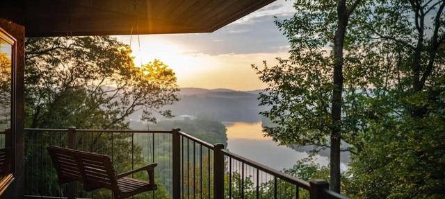 Stunning cliffside river view on private 60 acre forested retreat