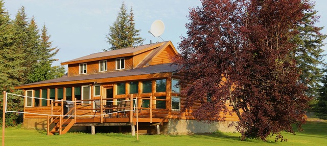 Unique Alaskan log home in trees & wild flowers on 14-acre private homestead.