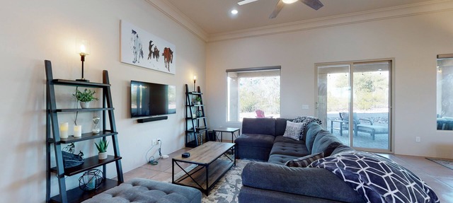 Updated home with mountain views, a private patio, grill, EV charger, W/D, & AC