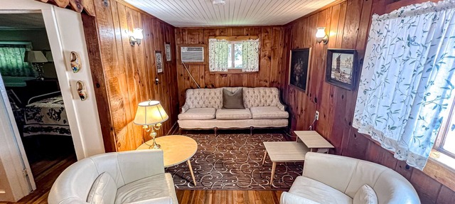 Waterfront 2BR cottage, beach, dock, lake views, fishing, wifi, partial A/C