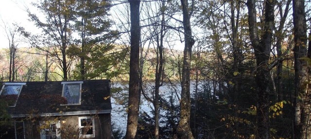 Waterfront Camp looking down on water from deck.
