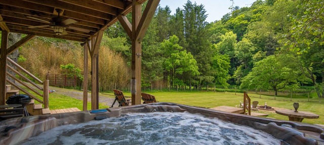 Woodsy Retreat with Hot Tub | Dogs Welcome | On River Time