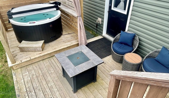 1 BRM suite w/kitchenette + hot tub + air conditioning- free off street parking